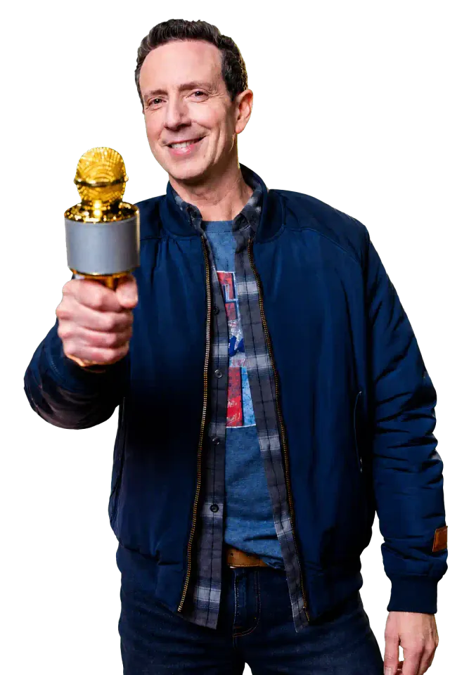 Adam Growe smiling and holding a gold microphone